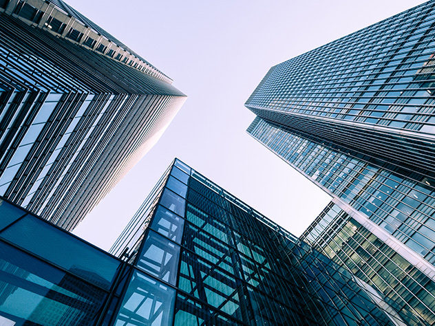  modern buildings in big cities,Reflection of Illuminated office building in glass office